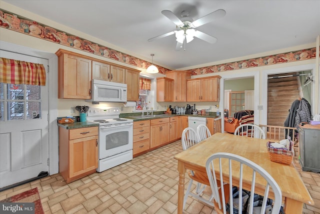 kitchen featuring ceiling fan, light brown cabinets, pendant lighting, and white appliances