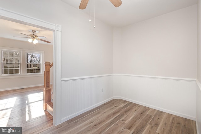 spare room with ceiling fan and light hardwood / wood-style floors