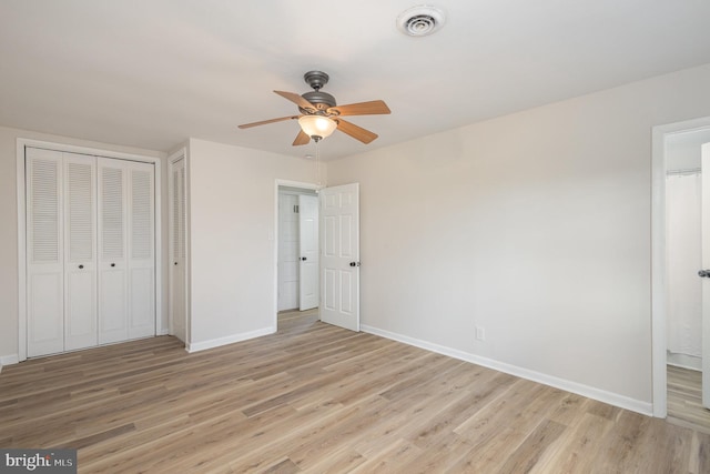 unfurnished bedroom featuring ceiling fan and light wood-type flooring