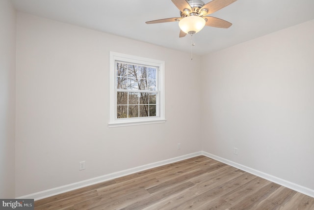 spare room featuring ceiling fan and light hardwood / wood-style flooring