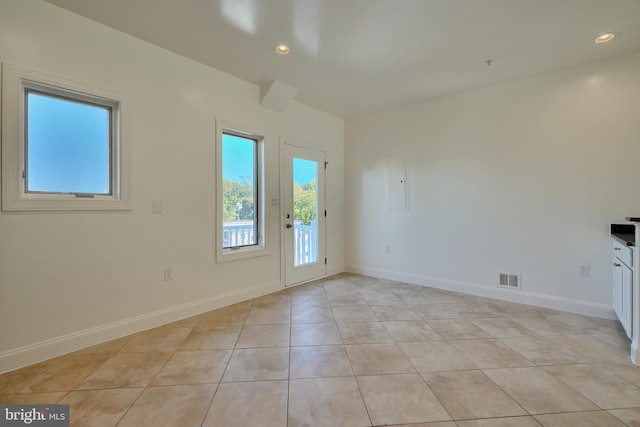 empty room with light tile patterned floors