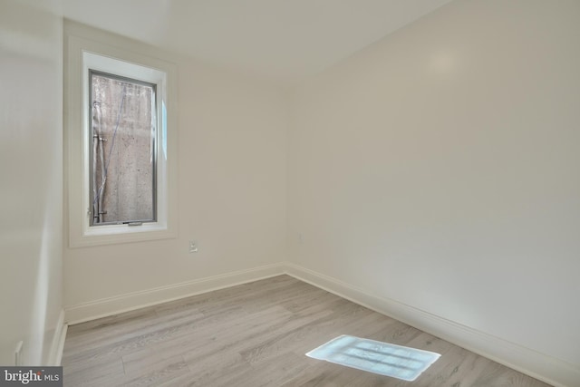 spare room with light wood-type flooring