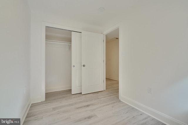 unfurnished bedroom with light hardwood / wood-style floors