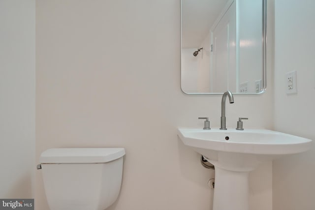 bathroom with toilet and sink