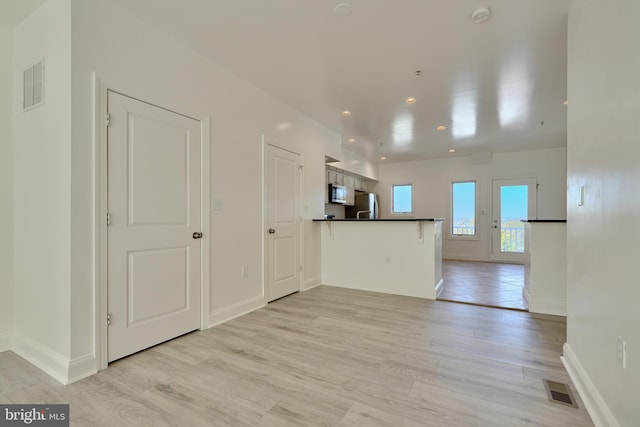 interior space with light hardwood / wood-style flooring