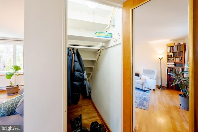 corridor with light hardwood / wood-style flooring