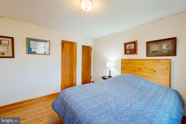 bedroom featuring wood-type flooring