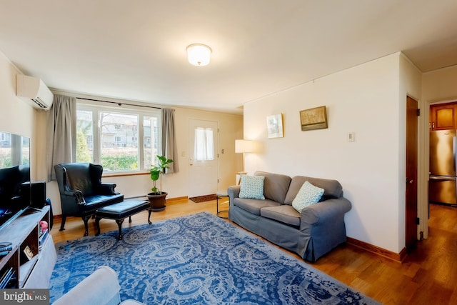 living room featuring an AC wall unit and wood-type flooring