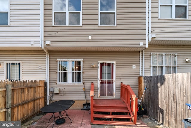 back of house with a patio