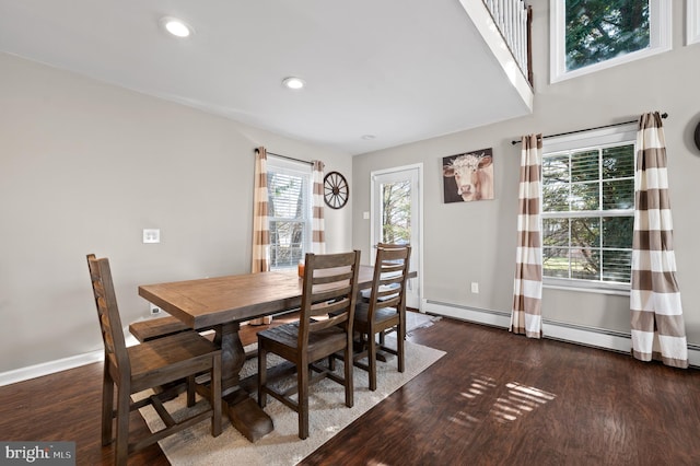 dining room featuring dark hardwood / wood-style flooring and a wealth of natural light