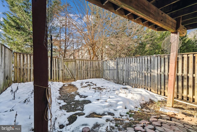 view of yard covered in snow