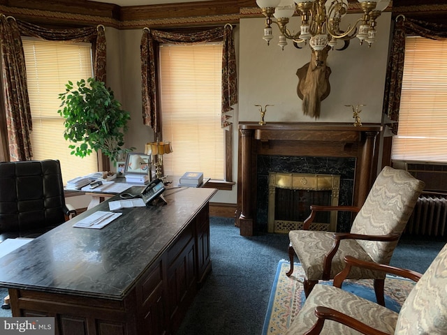 carpeted home office featuring radiator, a premium fireplace, cooling unit, and an inviting chandelier