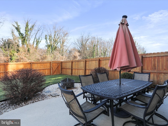 view of patio / terrace featuring a fire pit