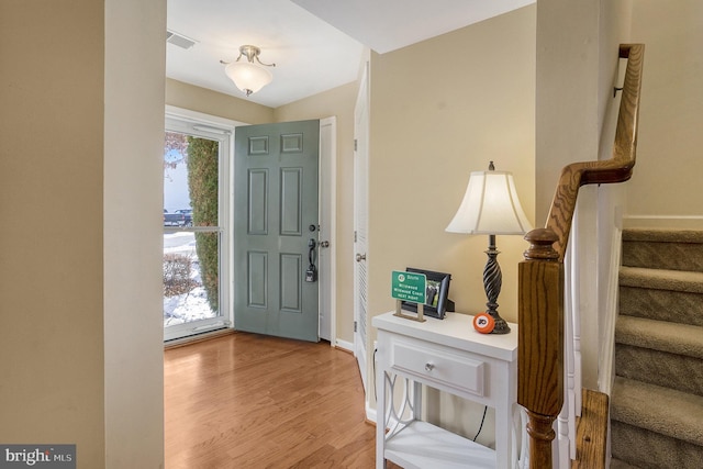 entrance foyer with light wood-type flooring