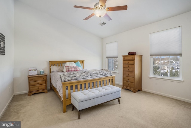 carpeted bedroom featuring vaulted ceiling and ceiling fan