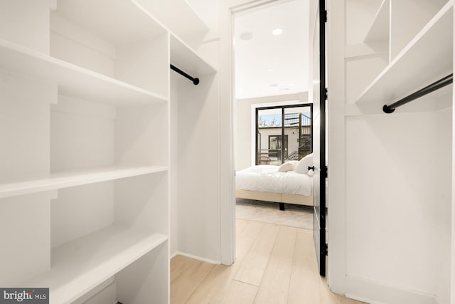 walk in closet featuring light wood-type flooring