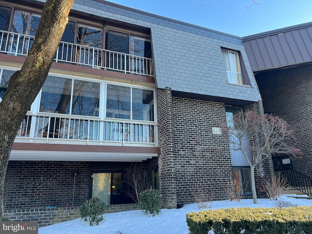 view of snow covered property