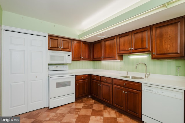 kitchen with sink and white appliances