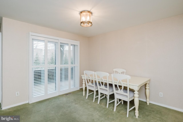 dining area with carpet