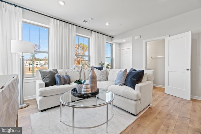 living room with light hardwood / wood-style floors