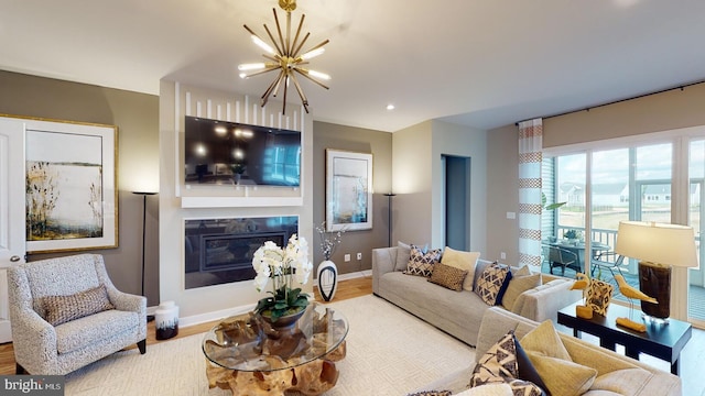 living room featuring a chandelier and hardwood / wood-style floors