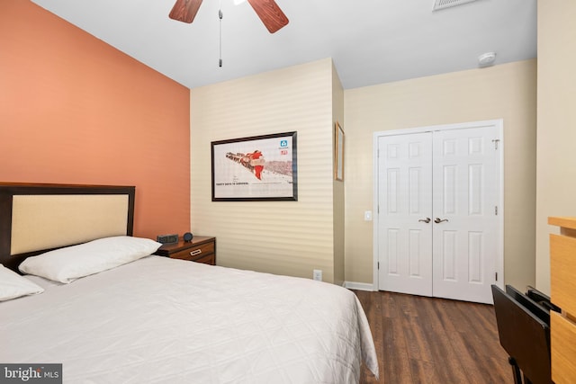 bedroom featuring dark hardwood / wood-style flooring, a closet, and ceiling fan