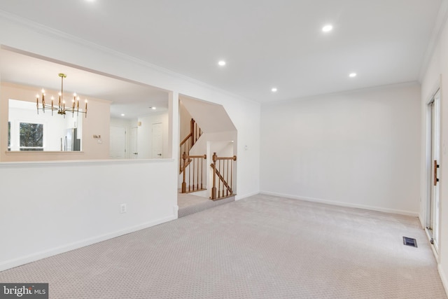 empty room with an inviting chandelier, light carpet, and crown molding