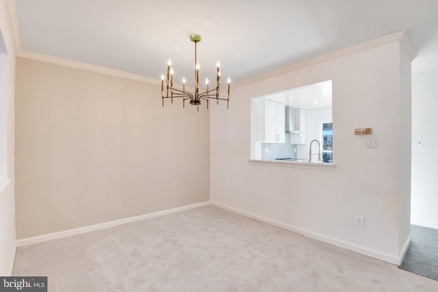 unfurnished dining area with a chandelier, crown molding, light carpet, and sink