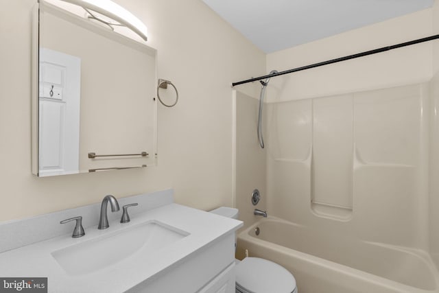 bathroom with shower / bathtub combination, vanity, and toilet