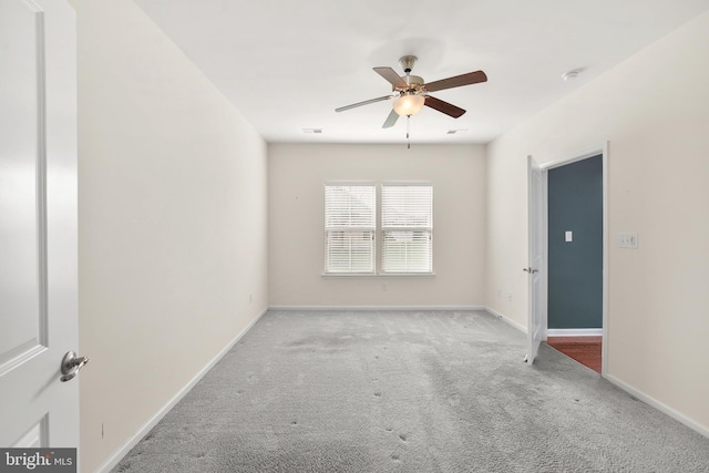 empty room with light carpet and ceiling fan