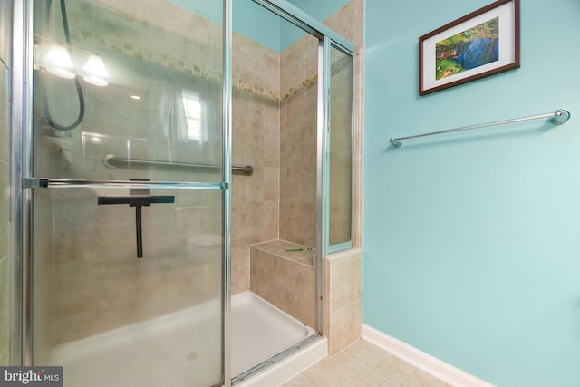 bathroom featuring tile patterned floors and walk in shower