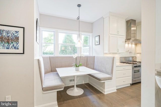 dining room with breakfast area and hardwood / wood-style flooring