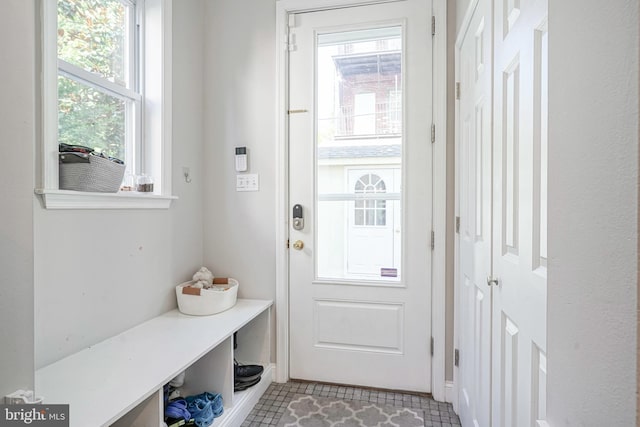 entryway featuring light tile patterned floors