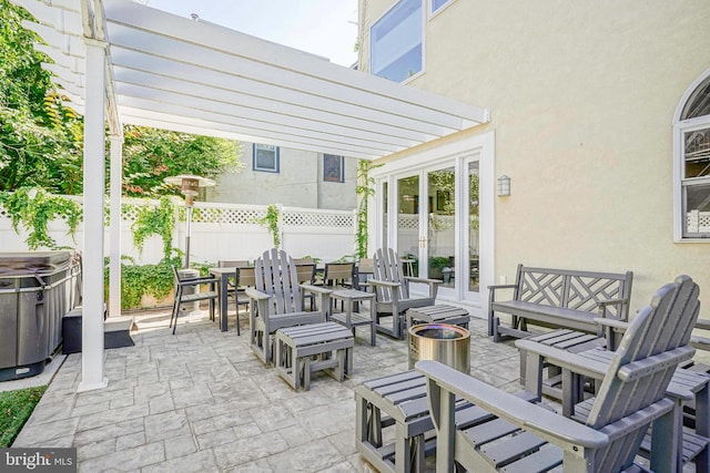 view of patio / terrace with french doors, a pergola, and an outdoor living space