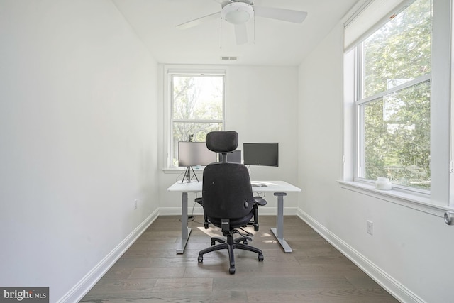 office with dark hardwood / wood-style flooring and ceiling fan