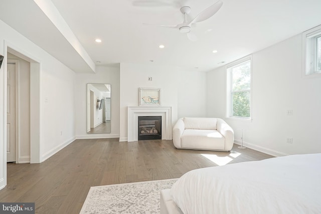 bedroom featuring wood-type flooring and ceiling fan