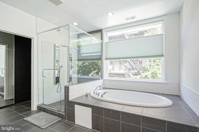 bathroom featuring separate shower and tub and tile patterned flooring