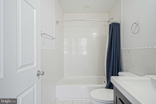 full bathroom with tile patterned flooring, shower / bath combo, vanity, and toilet