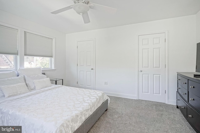 carpeted bedroom featuring ceiling fan