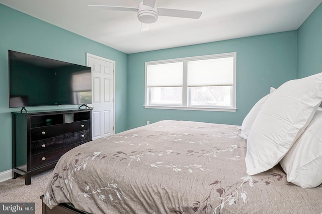 carpeted bedroom featuring ceiling fan