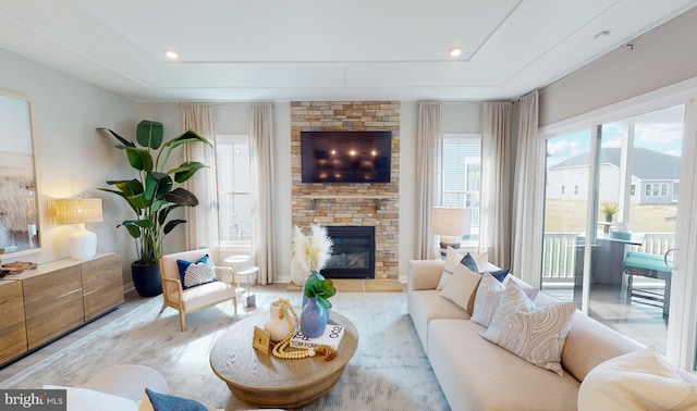 living room with a stone fireplace