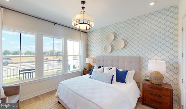 bedroom with light hardwood / wood-style flooring