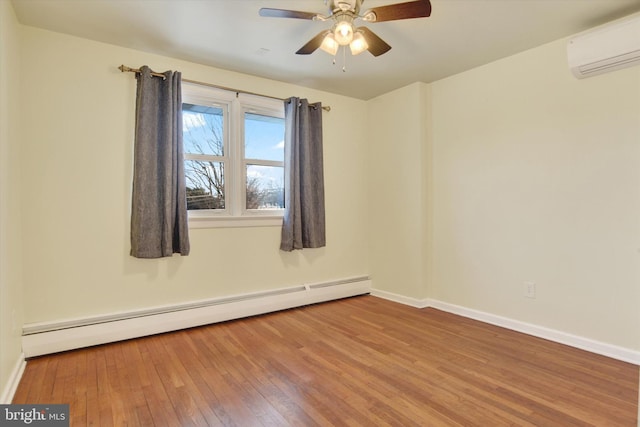 empty room with hardwood / wood-style floors, an AC wall unit, baseboard heating, and ceiling fan