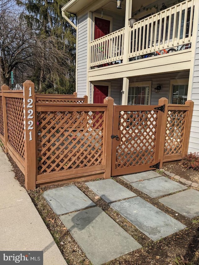 view of gate featuring a fenced front yard