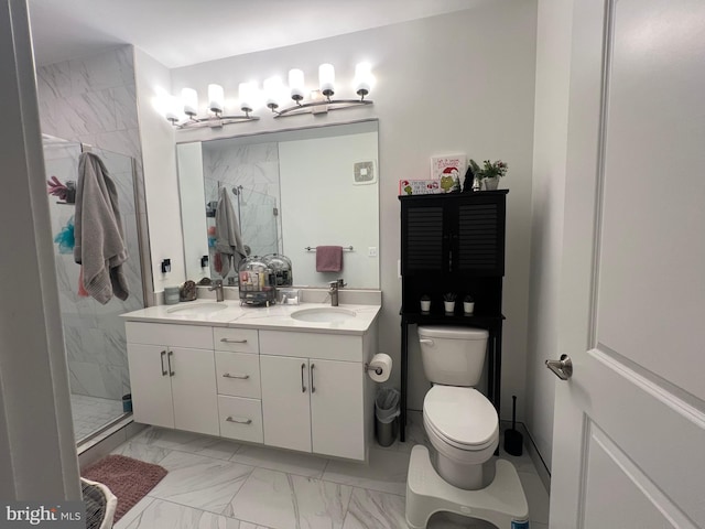 bathroom featuring vanity, toilet, and a shower with shower door