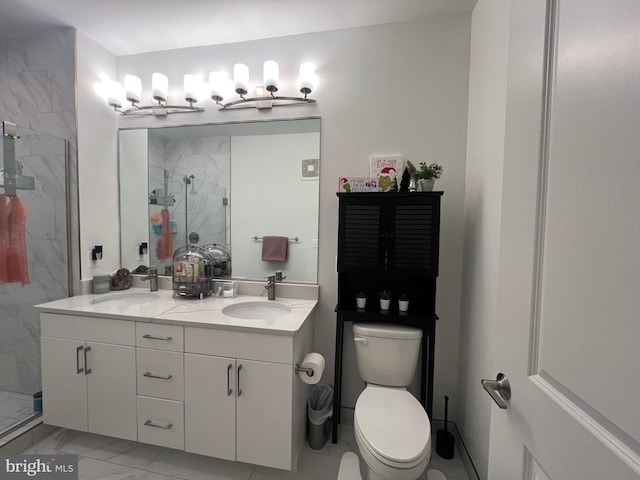 bathroom with a shower with door, vanity, and toilet