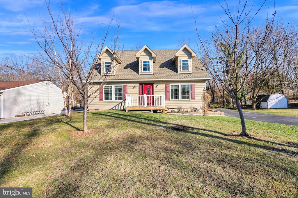 new england style home with a front yard