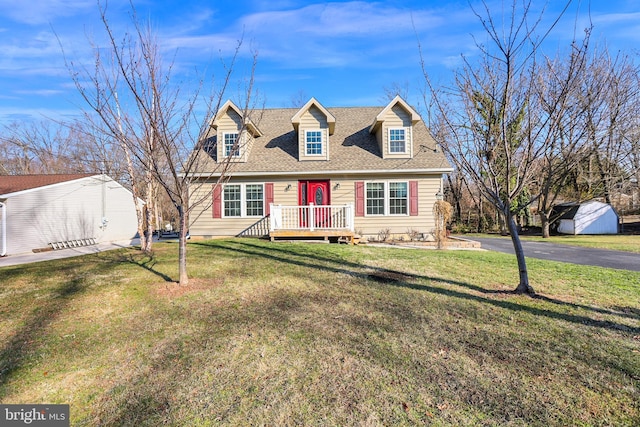 new england style home with a front yard