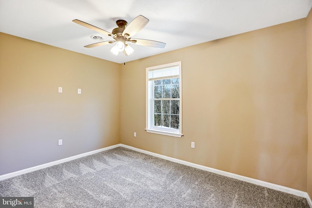 empty room with carpet and ceiling fan