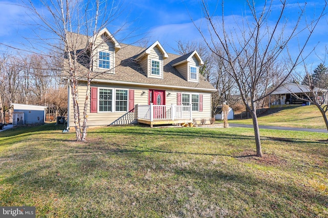 new england style home featuring a front yard